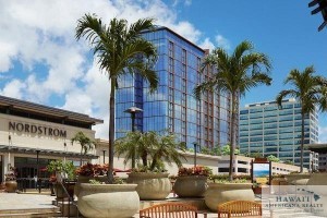 The Nordstrom department store at Ala Moana Center is seen in this photo depicting a rendering of the ONE Ala Moana luxury condominium project, recently completed construction atop the parking garage next to Nordstrom. Two penthouse units are on the market for a combined $22.3 million.